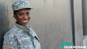 A woman in an Army uniform smiles.
