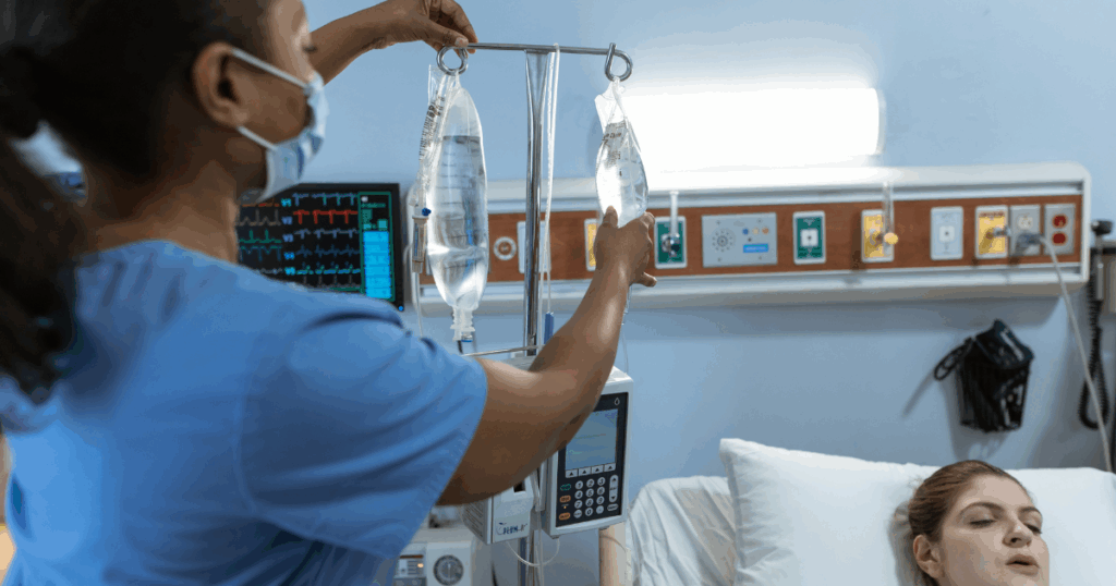 Nurse assisting patient with IV drip.