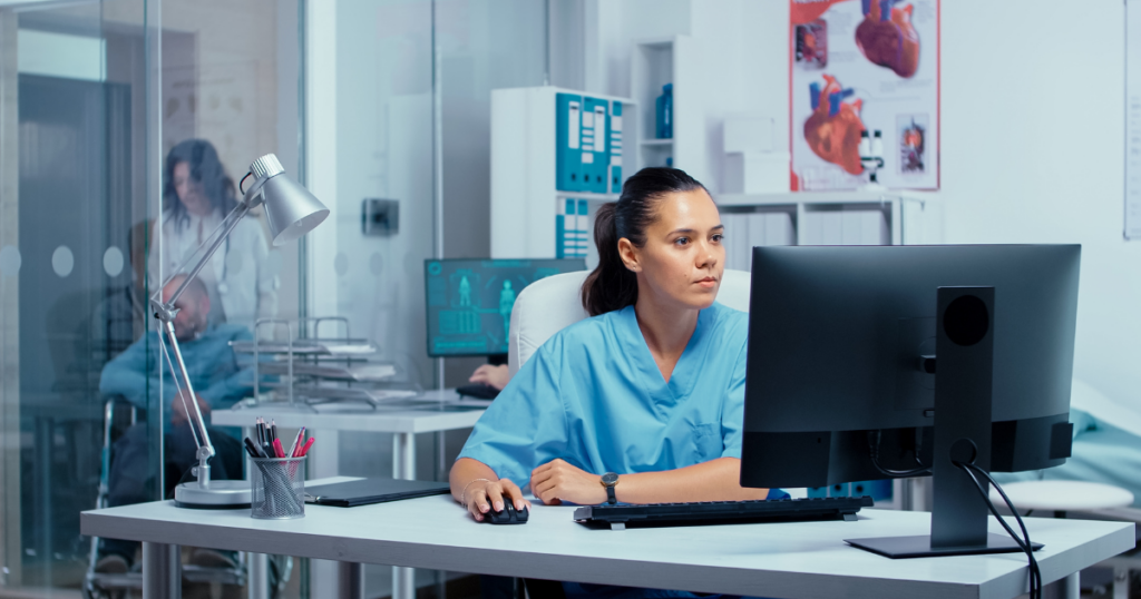 Nurse looking at a computer screen.