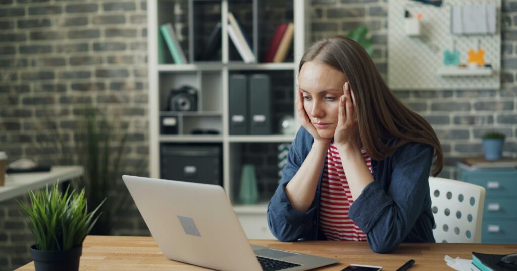 Texas nurse reading a BON investigation letter at her kitchen table